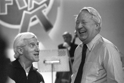 Necrophiliac, pedophile and DJ, Jimmy Saville on the left. Former Prime Minister Ted Heath on the right