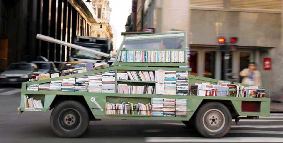 ARTIST TURNS CAR INTO A TANK ARMED WITH 900 BOOKS TO BE GIVEN AWAY FOR FREE