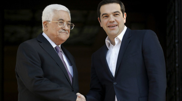 Greek Prime Minister Alexis Tsipras (R) welcomes Palestinian President Mahmoud Abbas at the Maximos Mansion in Athens, Greece, December 21, 2015. REUTERS/Alkis Konstantinidis