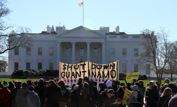 WASHINGTON DC, UNITED STATES - JANUARY 11: Protesters hold banners during a protest in front of the White House in Washington D.C, USA on January 11, 2016. The protesters demand from government to close the Guantanamo detention center at the US base in Guantanamo Bay of Cuba prior to its 14th anniversary of foundation. (Photo by Erkan Avci/Anadolu Agency/Getty Images)