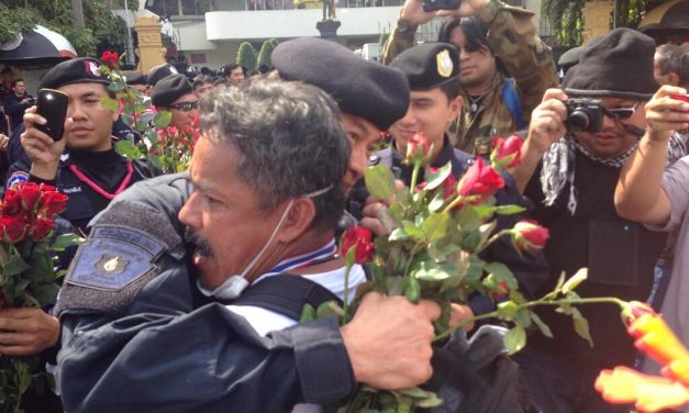 Police in Thailand Put Down Weapons and Join Protestors