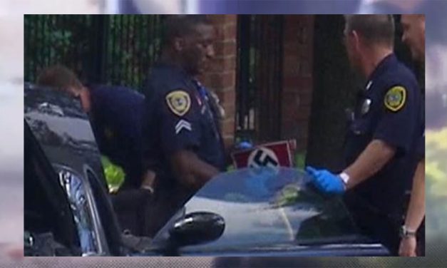 Gunman who wounded 9 was wearing Nazi paraphernalia