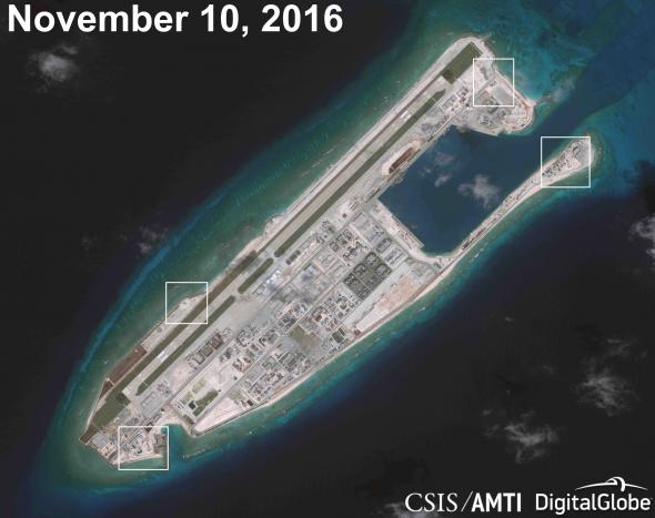 A satellite image shows what CSIS Asia Maritime Transparency Initiative says appears to be anti-aircraft guns and what are likely to be close-in weapons systems (CIWS) on the artificial island Fiery Cross Reef in the South China Sea in this image released on December 13, 2016. Courtesy CSIS Asia Maritime Transparency Initiative/DigitalGlobe/Handout via REUTERS